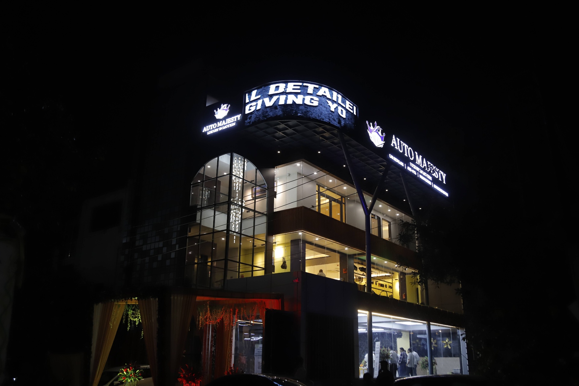 Fully lit — the marquee running late into the night.